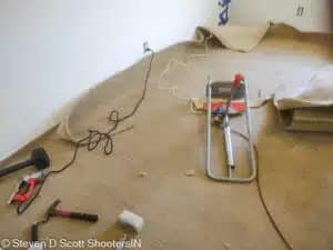 Stretching new carpet installed